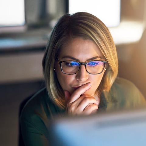 Woman with Glasses On Computer