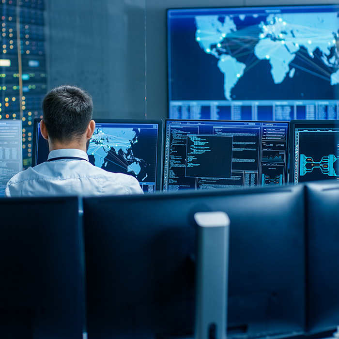 maps-data-center-man-by-computer maps-data-center-man-by-computer